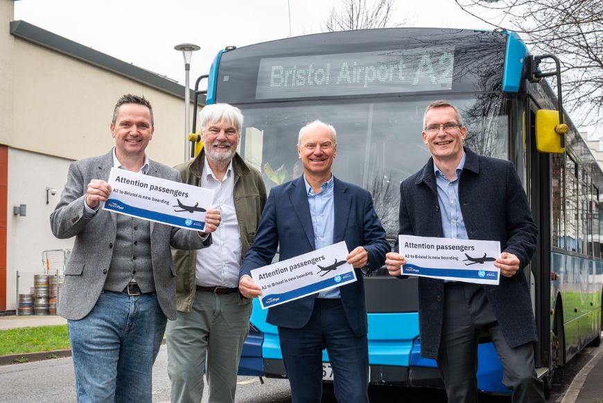 men in front of a bus